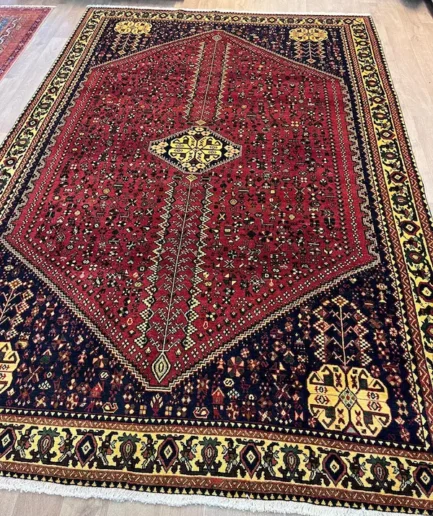 Traditional red and black patterned rug