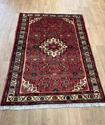 Intricate red patterned Persian rug