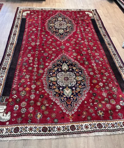 Vibrant red patterned Persian rug.