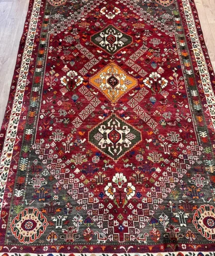Vibrant red patterned traditional Persian rug