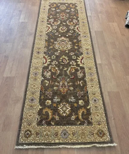 Ornate patterned runner rug on floor