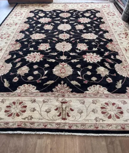 Intricate floral patterned Afghan rug.